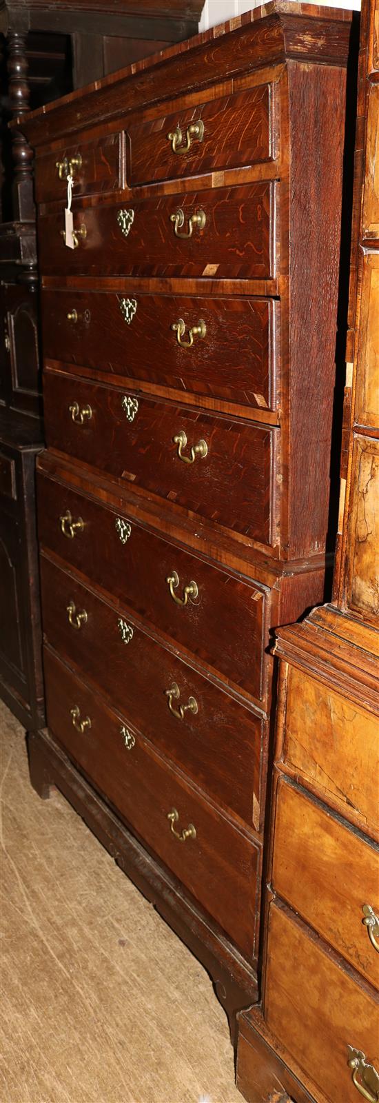 A George III walnut and oak chest on chest, W. 3ft 3in. D. 1ft 10.25in. H. 5ft 4.5in.